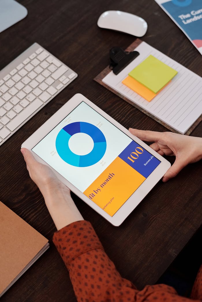 Modern office setting featuring a digital tablet displaying a graph, perfect for business presentations.